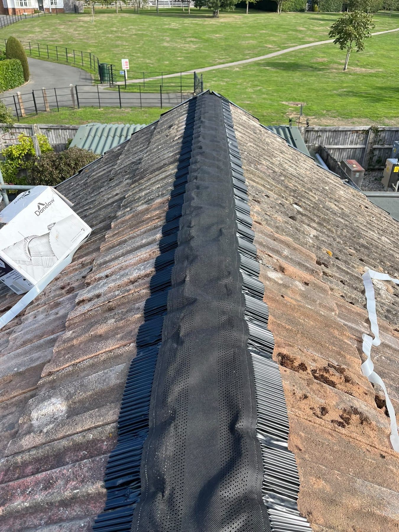 A dry ridge roll laid along the top of a tiled roof, ready for the ridge tiles